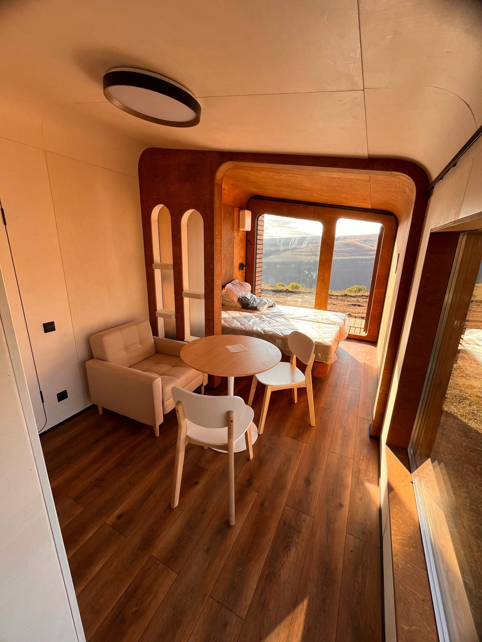 BRO6 sleeping and lounge interior with panoramic view