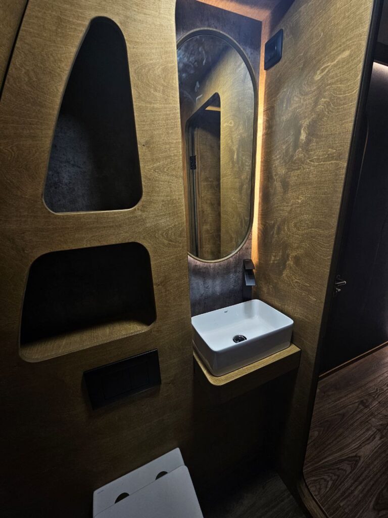HIZ bathroom vanity with a curved mirror