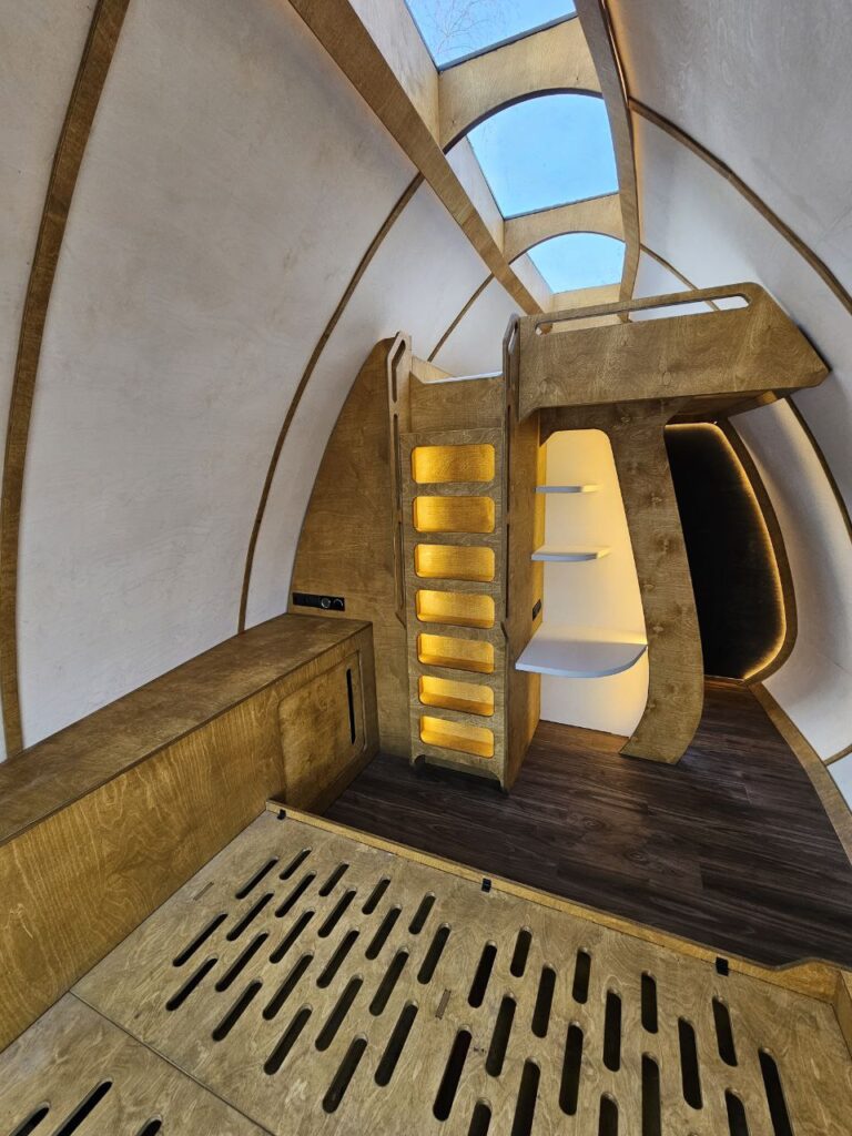 Illuminated HIZ stairs leading to the upper sleeping level