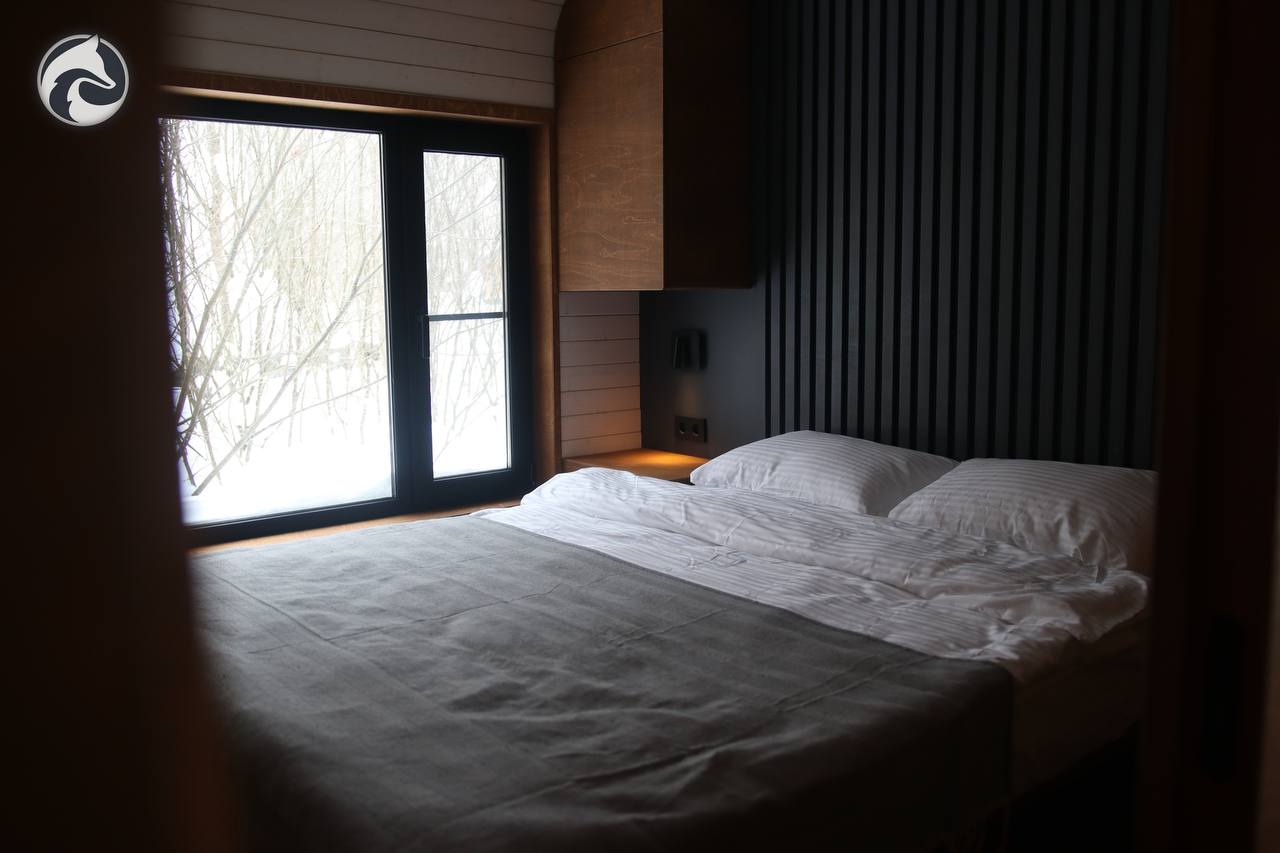 BARN 57 bedroom with a double bed and woodland view