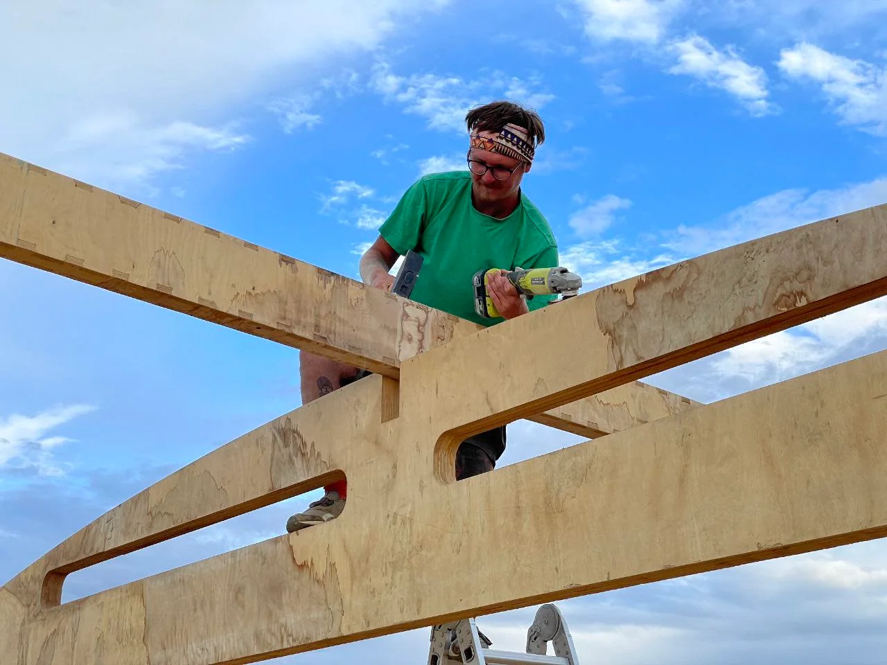 Timber wall and roof framing being assembled for a compact cabin